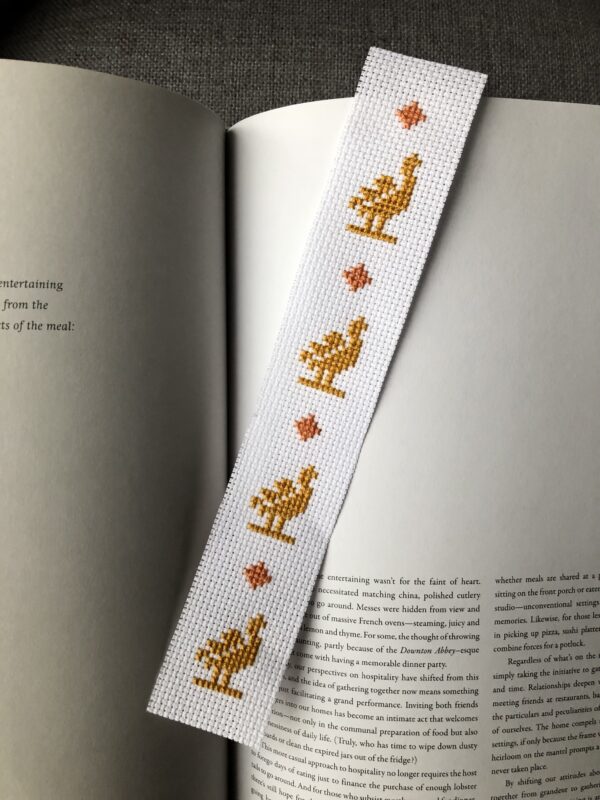 Bookmark embroidered with yellow birds.