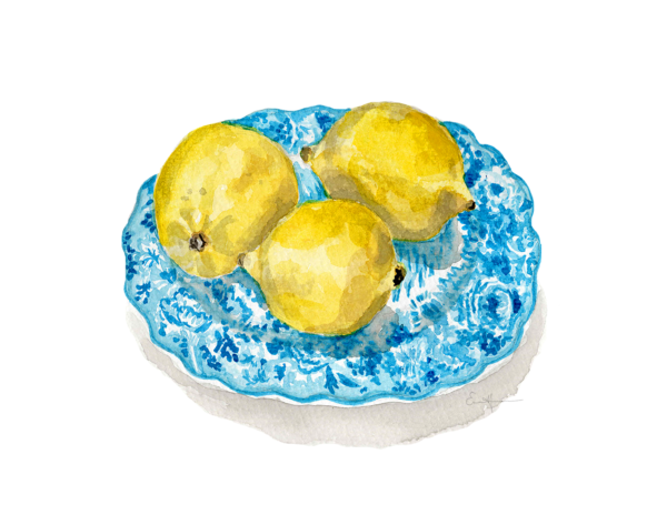 Three lemons on a blue porcelain plate.