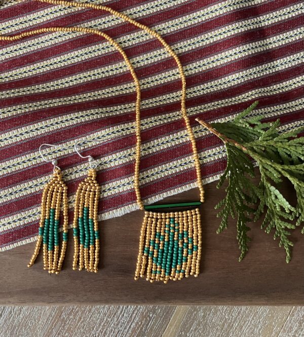 Necklace and earrings in gold and green.